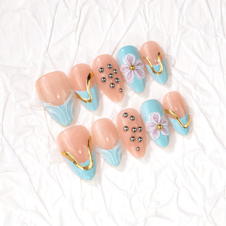 Artistic Press-On Nail Set with Floral and Metal Accents