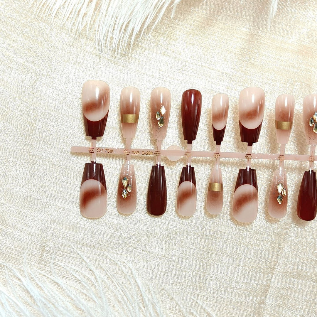 Artificial nails with elegant color gradients and jewelry details Kalsten
