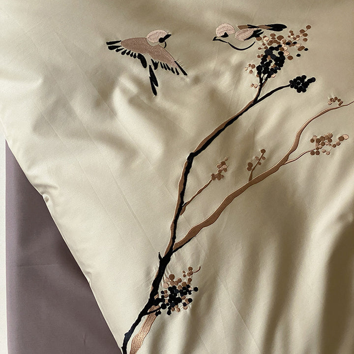 Reversible cotton satin bed set with finely embroidered bird and branch motifs