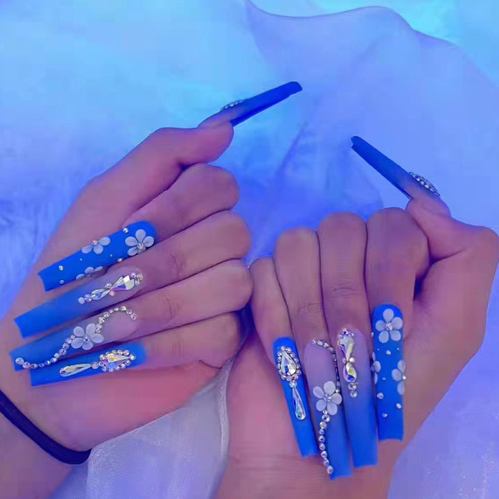 Nail art set with elegant 3D flower designs and glitter accents Kalsten