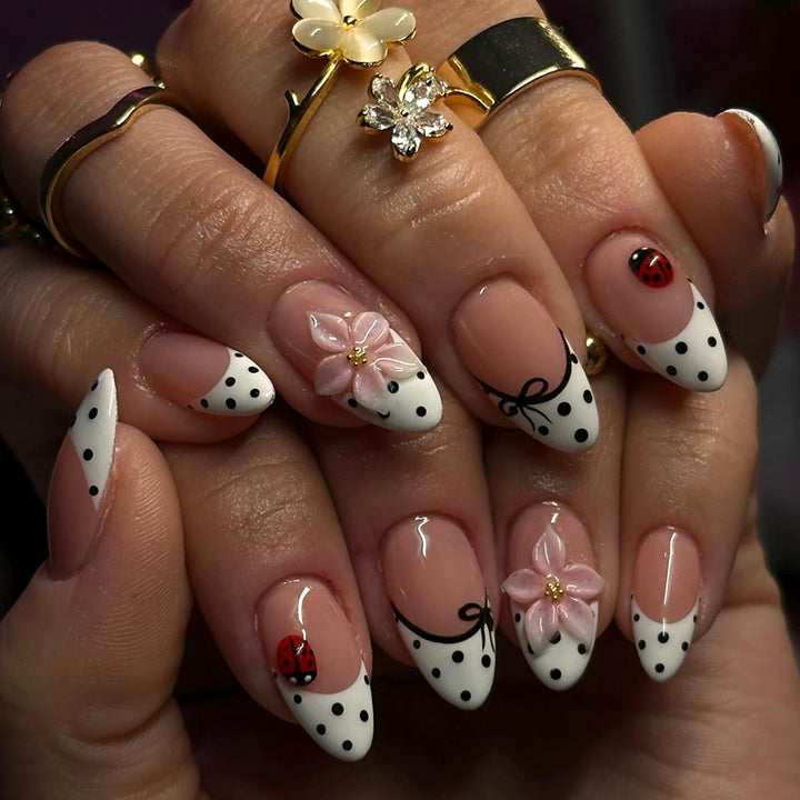 Artificial nail art with floral and playful accents Kalsten