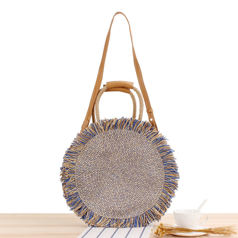 Round bag with fringe decoration Made of woven material Kalsten
