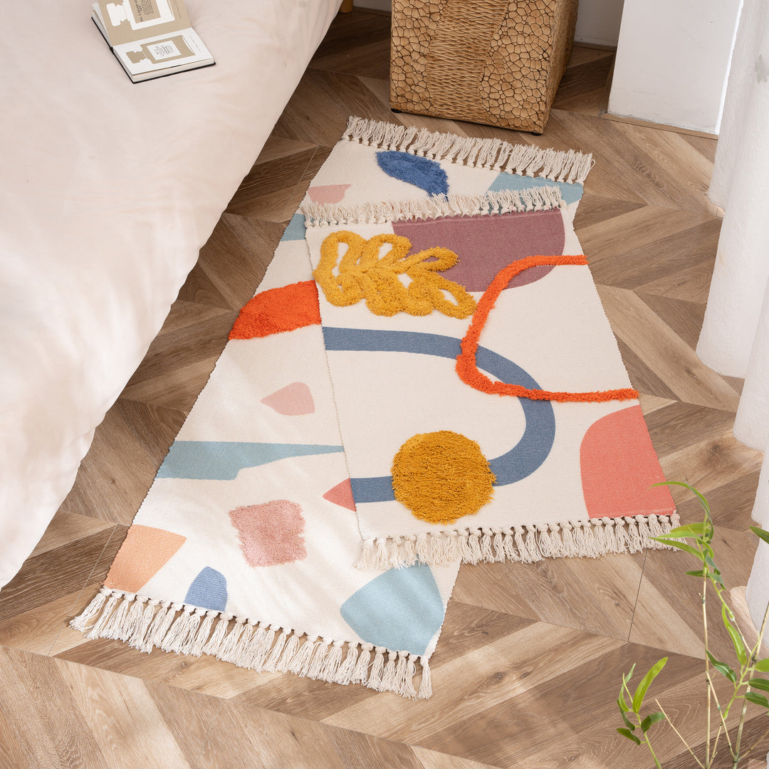 Woven runner with hand-tufted 3D applications and fringes