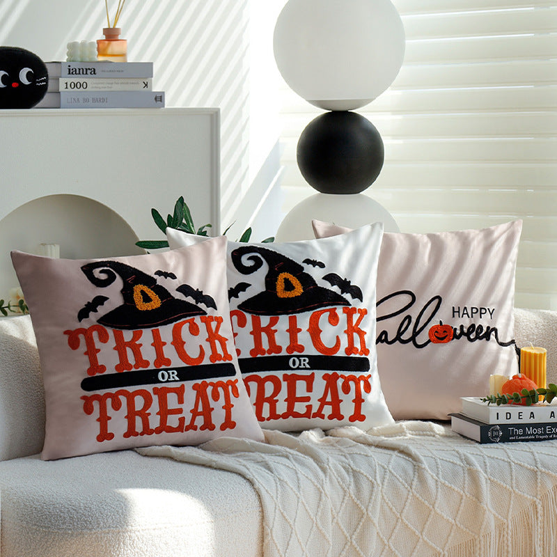 Square decorative cushion cover with witch hat appliqué and 'Trick or Treat' tufting Kalsten