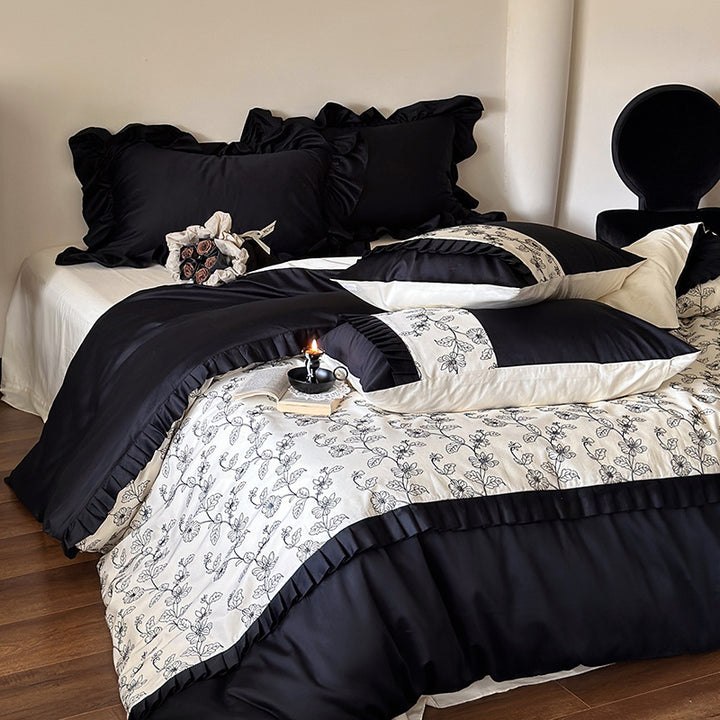 Luxurious cotton satin bedding set with ruffles and delicate floral embroidery