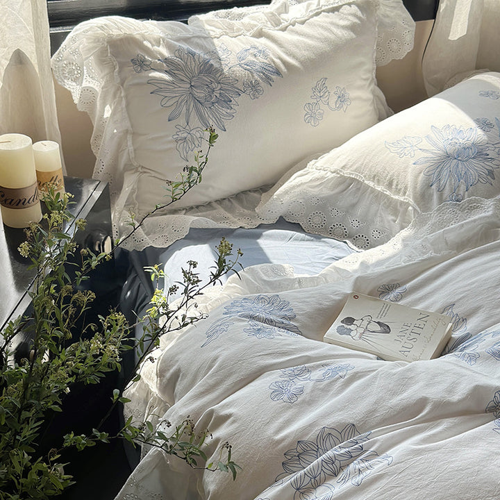Embroidered bedding set in country house style with ruffled edging and eyelet lace