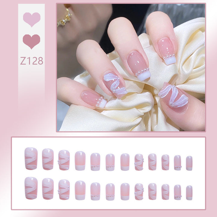Nail art set with elegant wave patterns and delicate pearl accents Kalsten