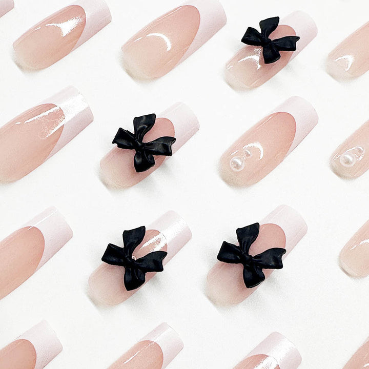 Acrylic nail set with stylish black and pearl details Kalsten