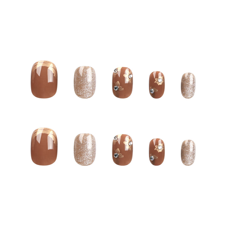 Elegant Nail Decoration with Glitter and Floral Accents Kalsten