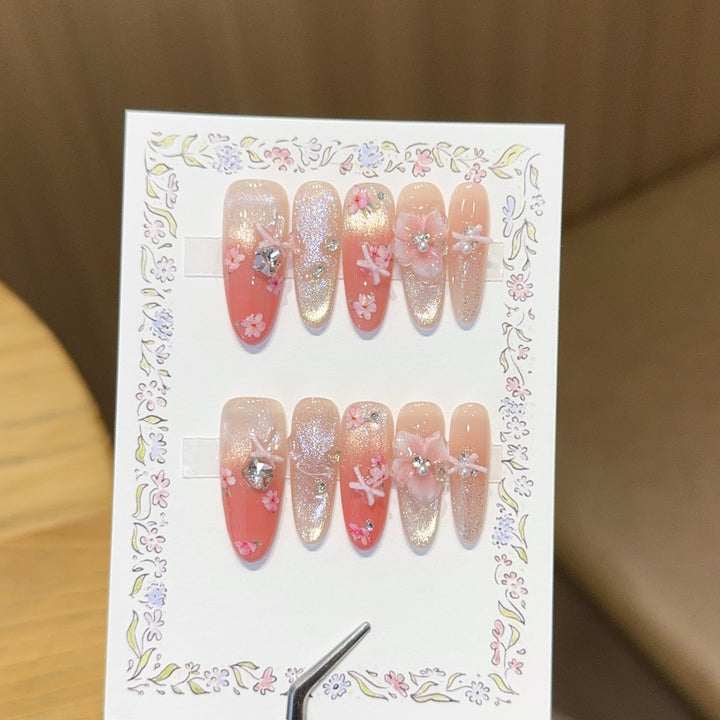 Artificial nails with floral embellishments and glitter effects Kalsten