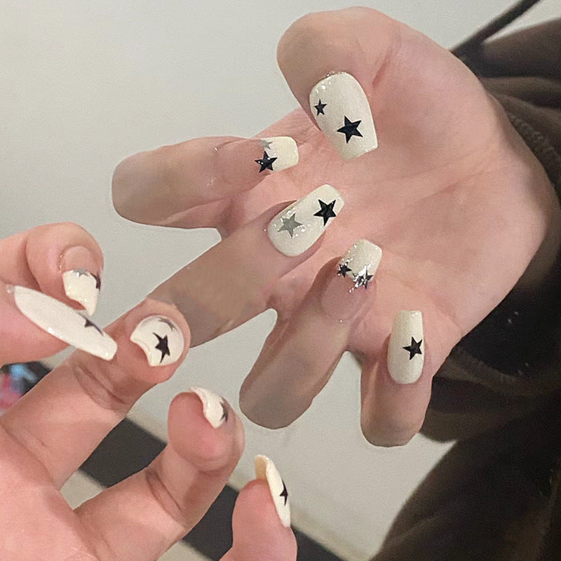 Artificial nail set with glamorous star design and sparkling accents Kalsten