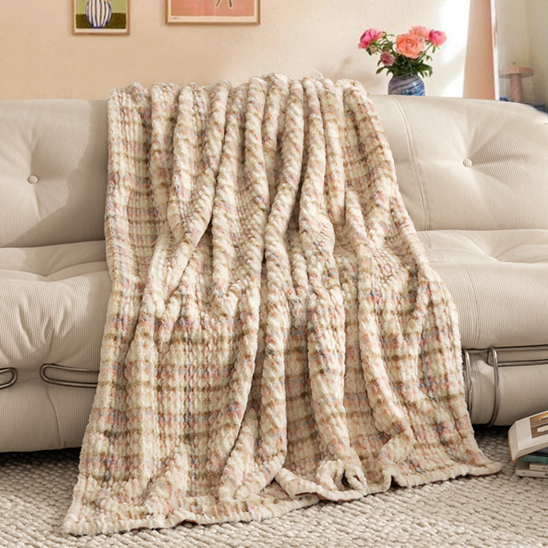 Cozy blanket made of luxurious synthetic fur with wavy texture and soft microfiber back Kalsten
