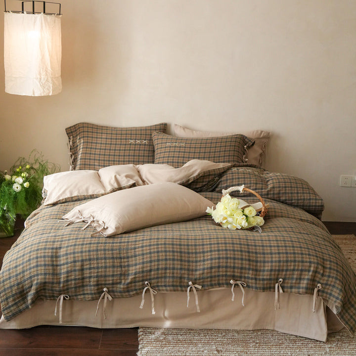 Checked cotton bedding set with decorative ribbons, ruffles, and subtly embroidered detail