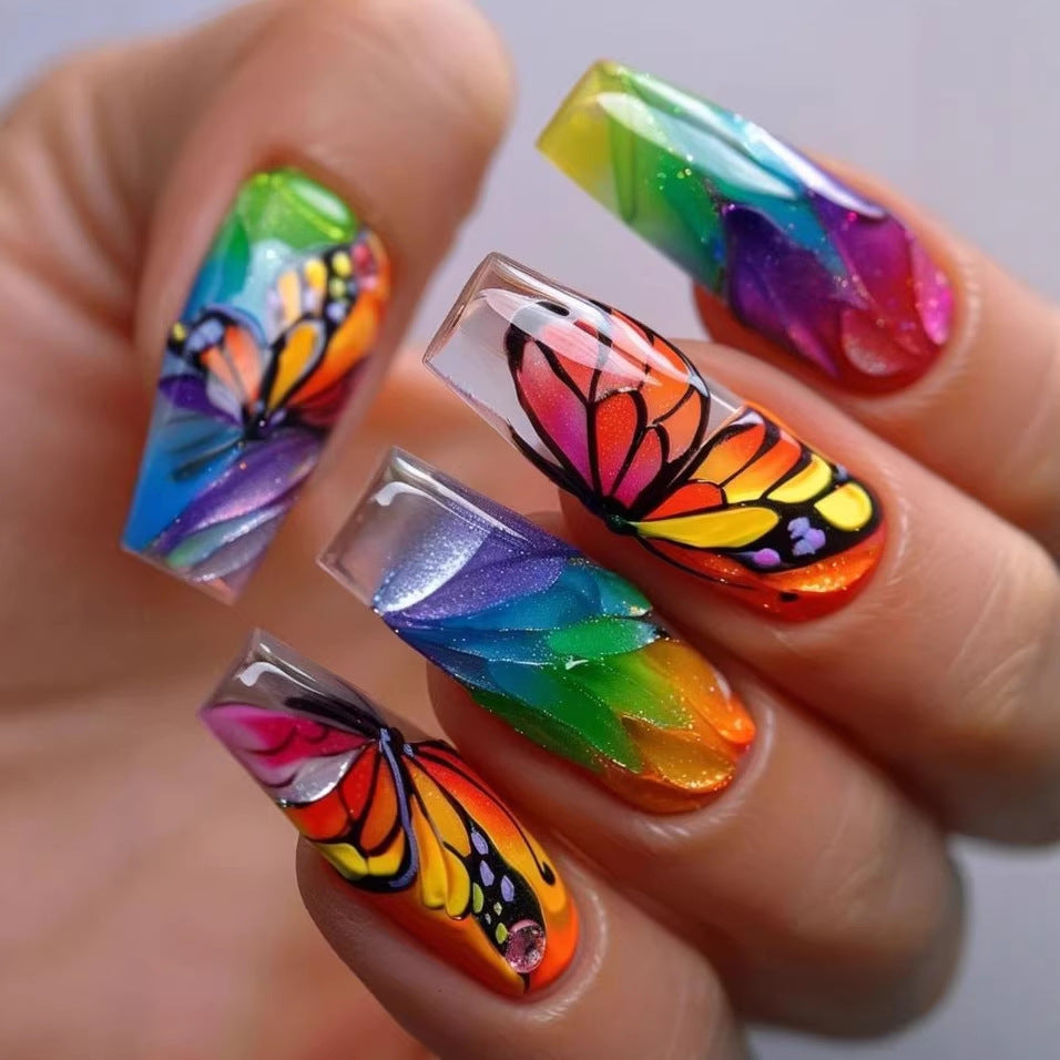 Artificial nails with colorful butterfly design and holographic accents Kalsten