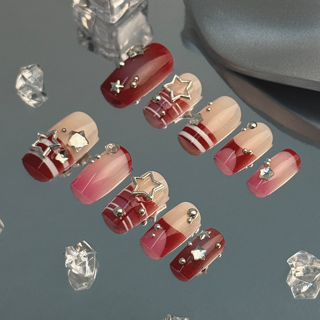 Artificial fingernails with handcrafted star decorations Kalsten