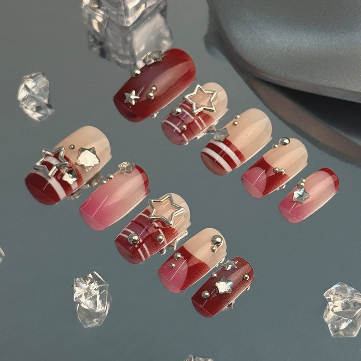 Artificial fingernails with handcrafted star decorations Kalsten