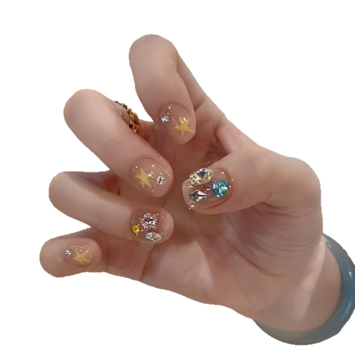 Glittering nail tips with elegant jewelry accents Kalsten