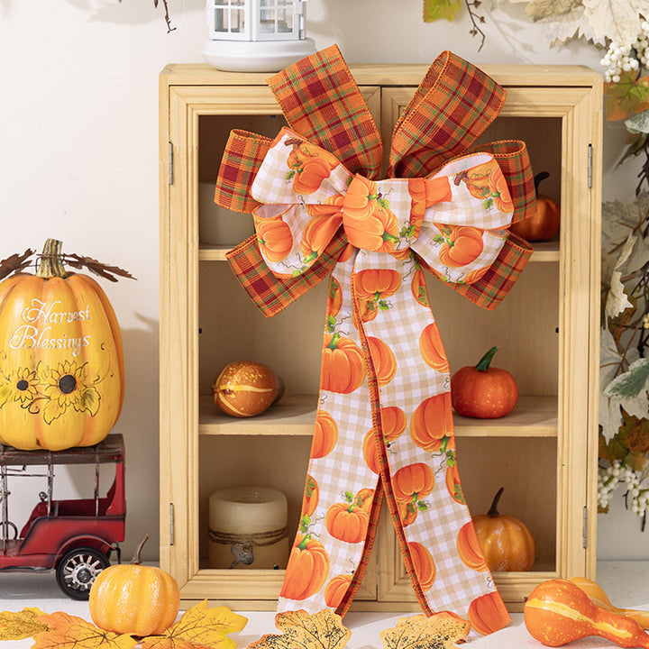 Large autumn door bow made of jute with pumpkin print and gingham ribbons