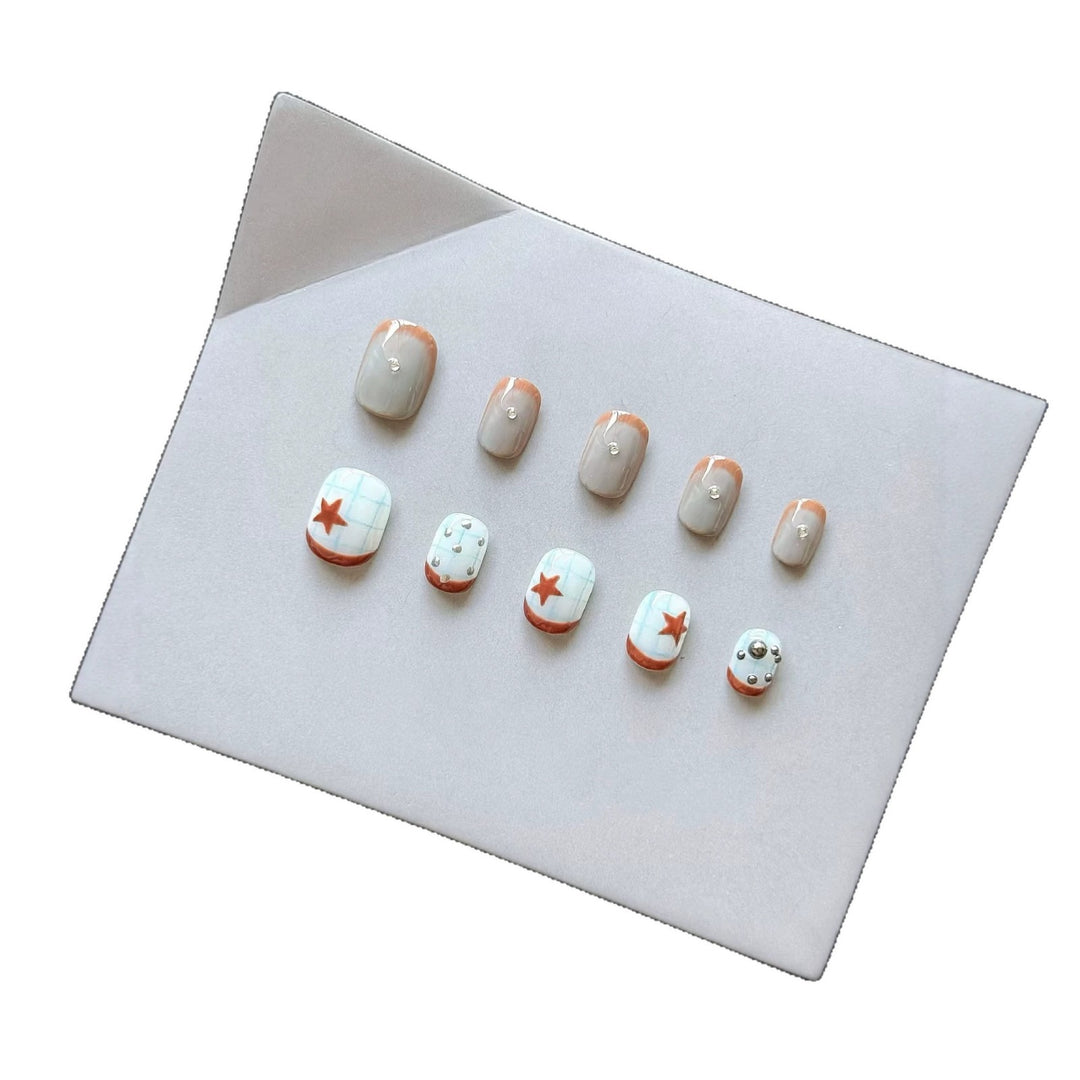 Artistic Press-On Nail Art Set with Star and Metallic Accents