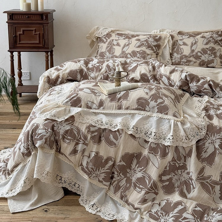 Vintage-inspired cotton-linen bedding set with large floral pattern, ruffle, and lace appliqué