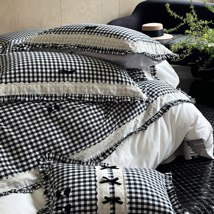 Bedding set in country house style with Vichy check, ruffle and embroidery appliqués