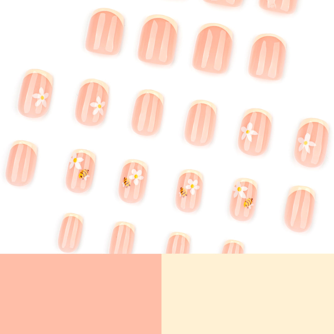 Artificial nail art with flower and bee motifs Kalsten