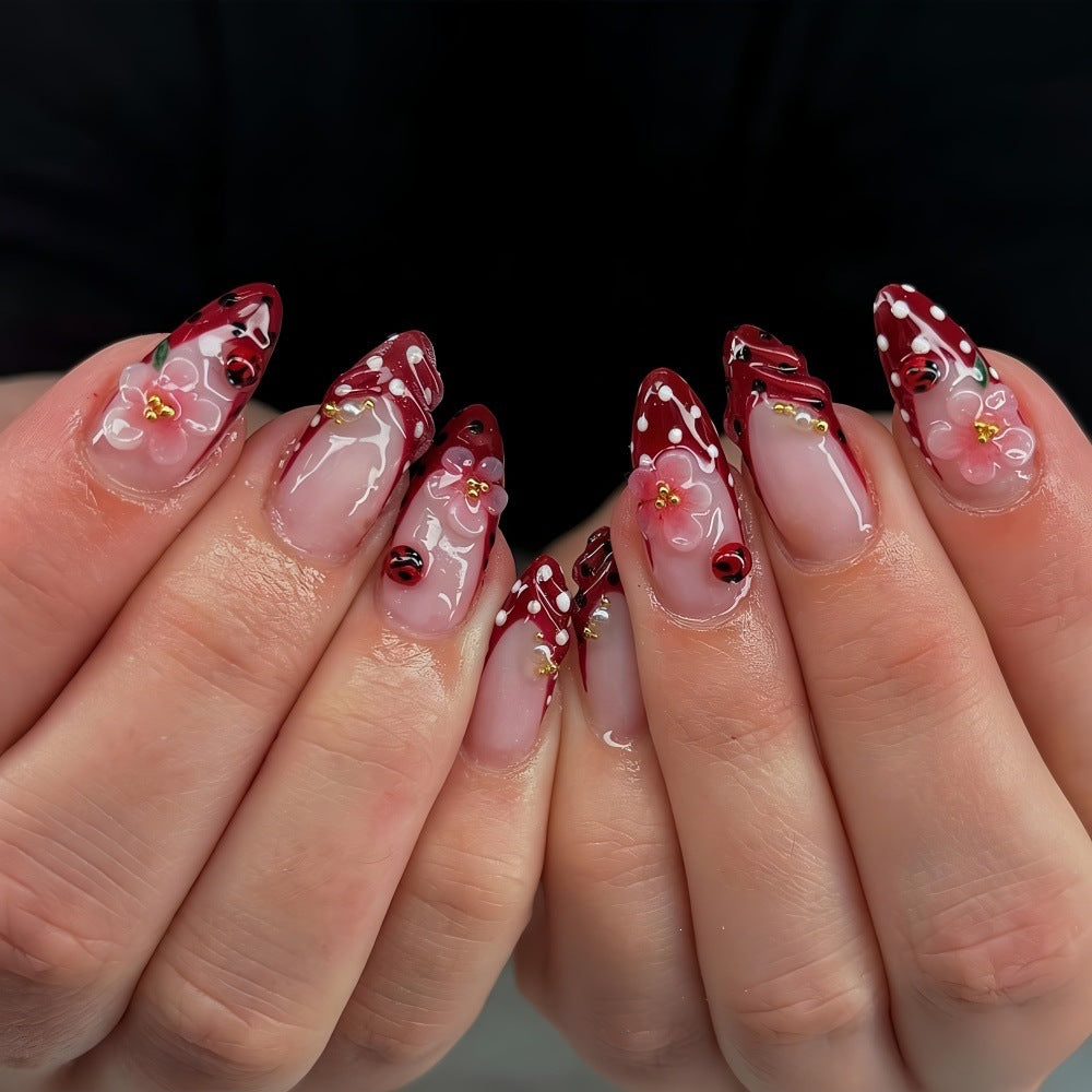 Creative tip design artificial nails with floral accents Kalsten