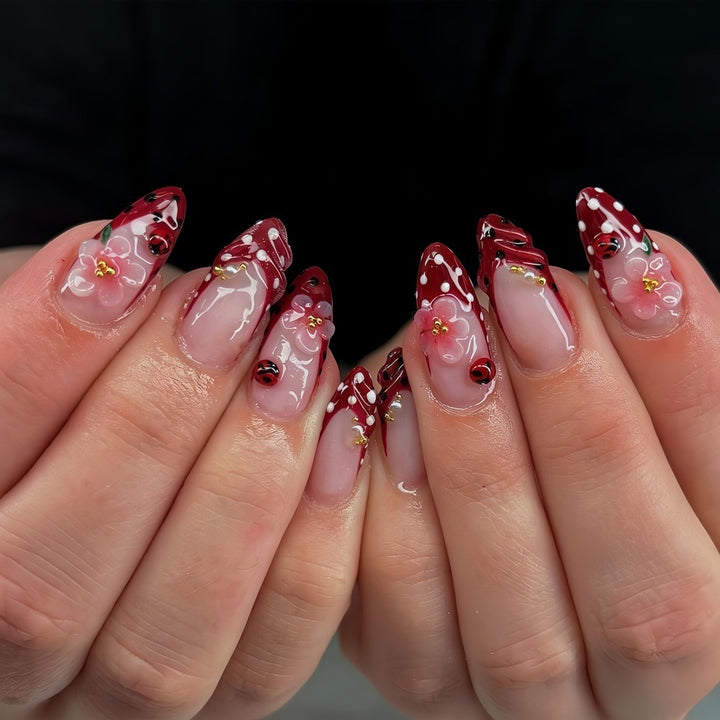 Creative tip design artificial nails with floral accents Kalsten