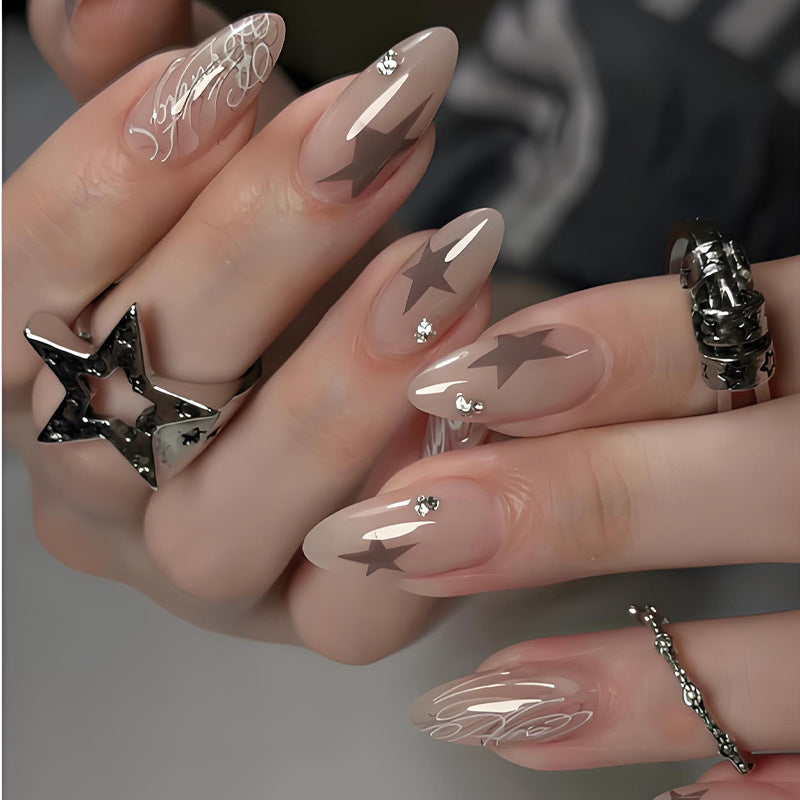 Artificial nail set with elegant star motifs and glitter accents Kalsten