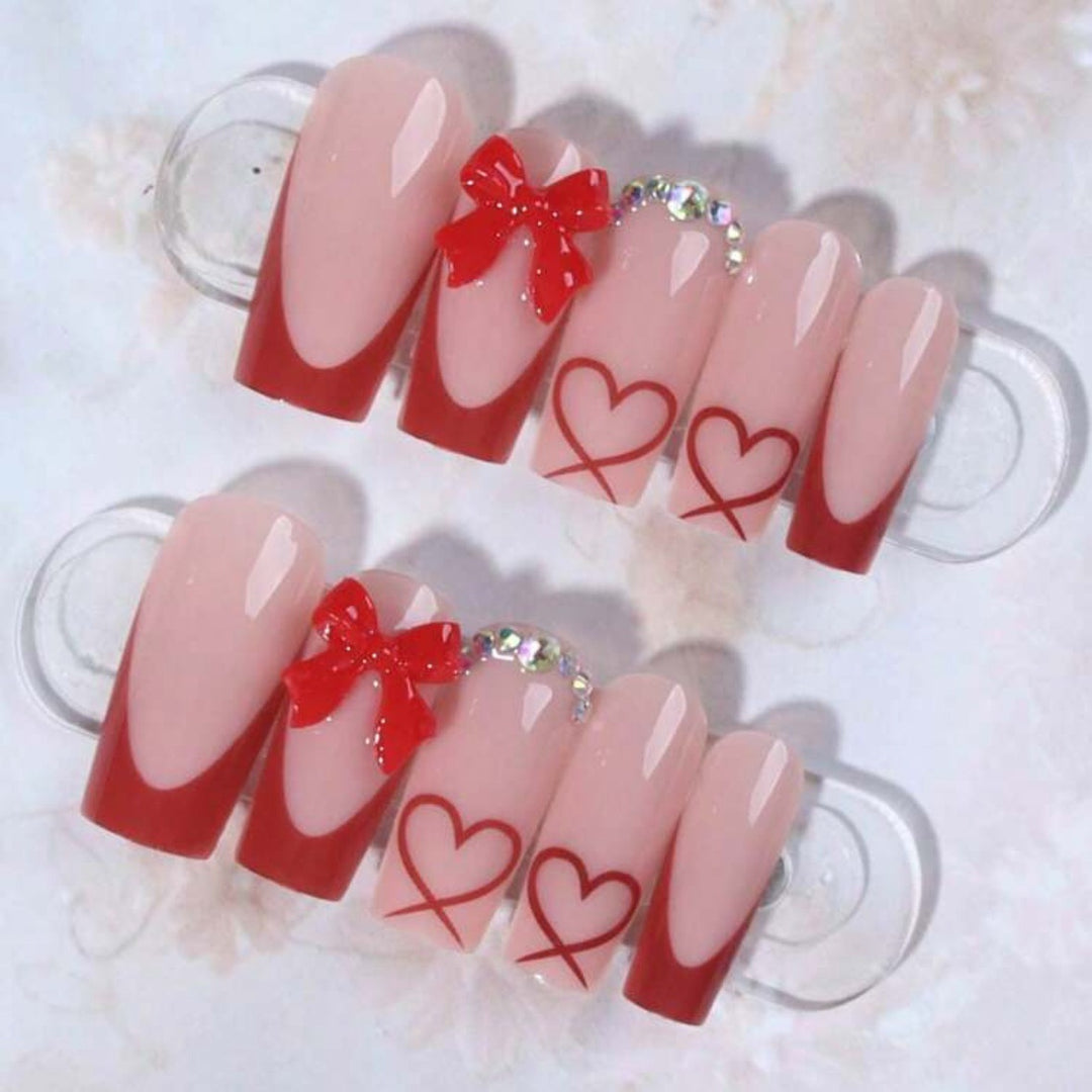 Nail art with heart and bow motifs Kalsten