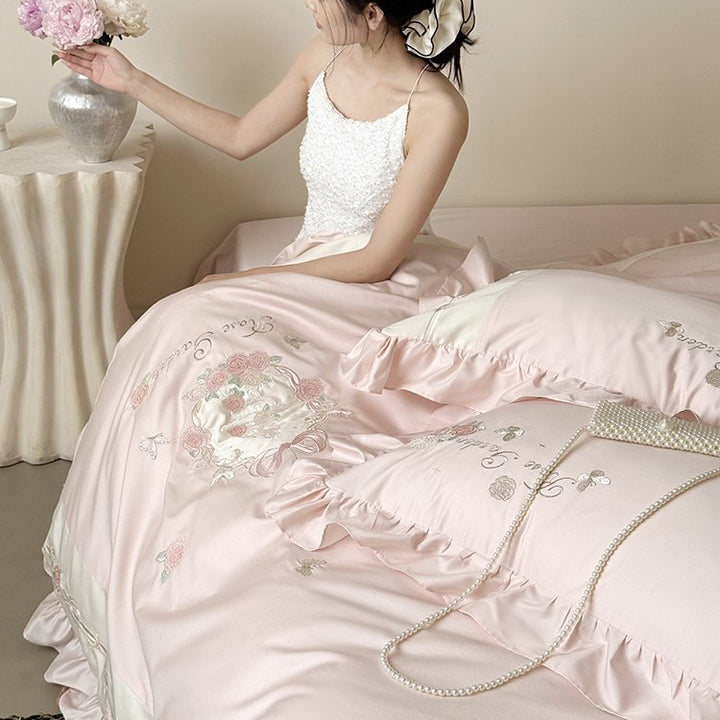 Delicate embroidered cotton satin bedding set with ruffle, satin trim, and rose motif