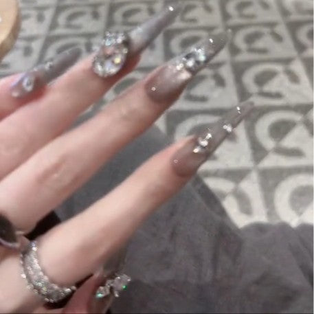 Glamorous artificial nails with rhinestone accents Kalsten