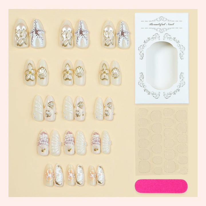 luxurious artificial nail set with maritime designs and golden accents Kalsten