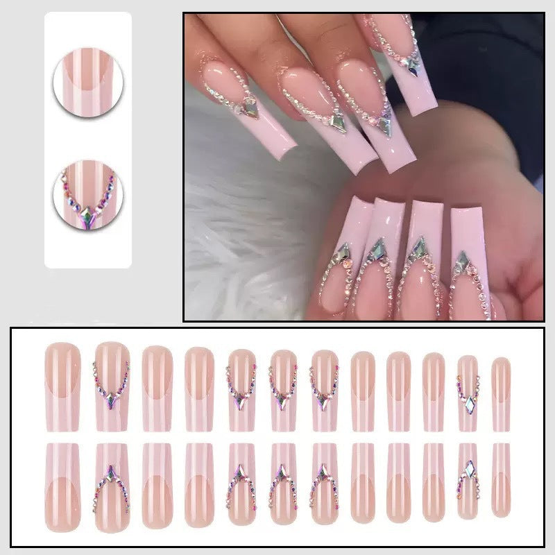 Glamorous artificial nails with sparkling rhinestone embellishments Kalsten