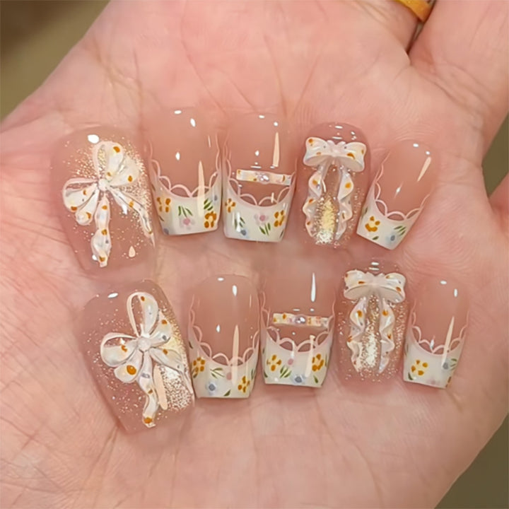 Artful Nail Extensions with Floral Design and Bow Accents Kalsten