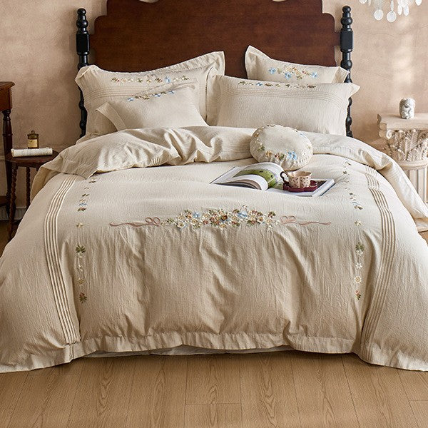 Soft cotton gauze bed set with hand-stitched flowers and decorative ruffle