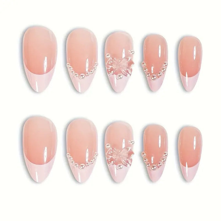Art nail tips with delicate pearl and butterfly accents Kalsten