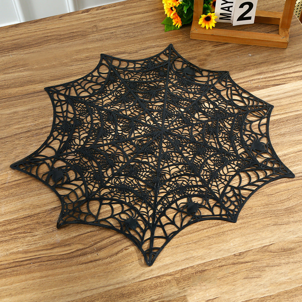Flexible spiderweb table mat made of heat-resistant silicone as a placemat and decorative coaster with spider relief