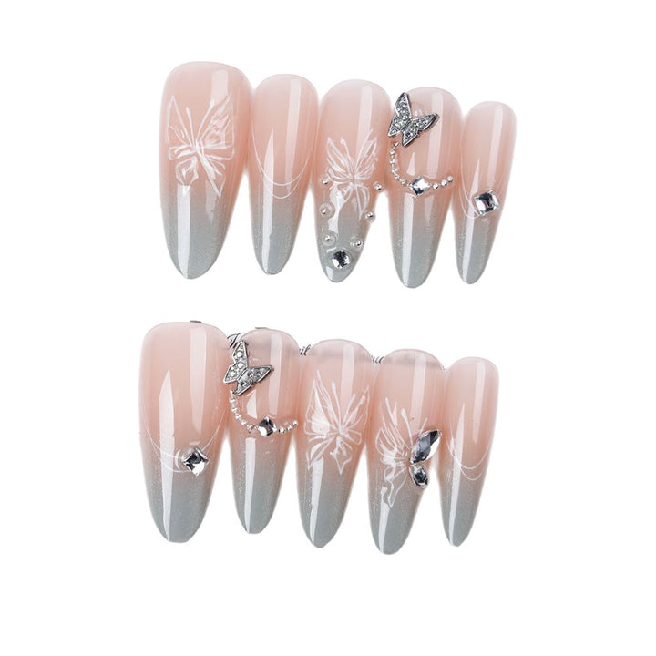 Elegant Stiletto Nail Enhancements with Crystal Accents
