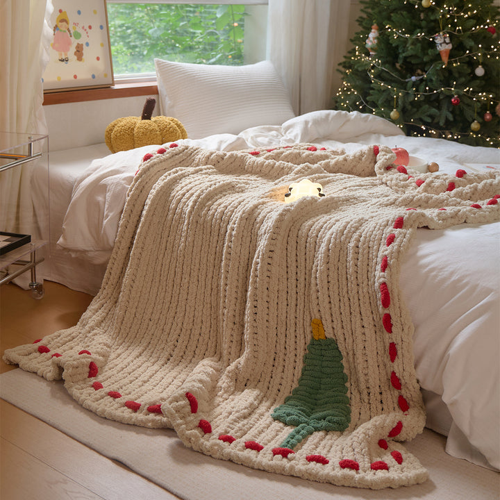 Cozy daybed cover with relief teddy structure, fir motif, and contrasting decorative seam