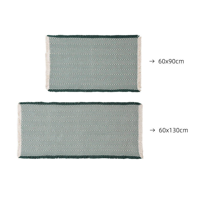 Handwoven cotton bath mat with herringbone pattern and fringes Kalsten