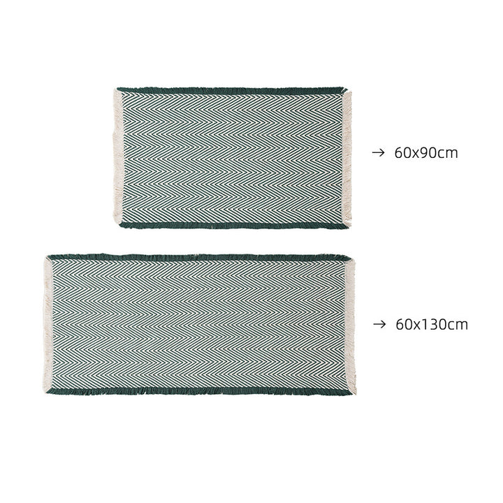 Handwoven cotton bath mat with herringbone pattern and fringes Kalsten