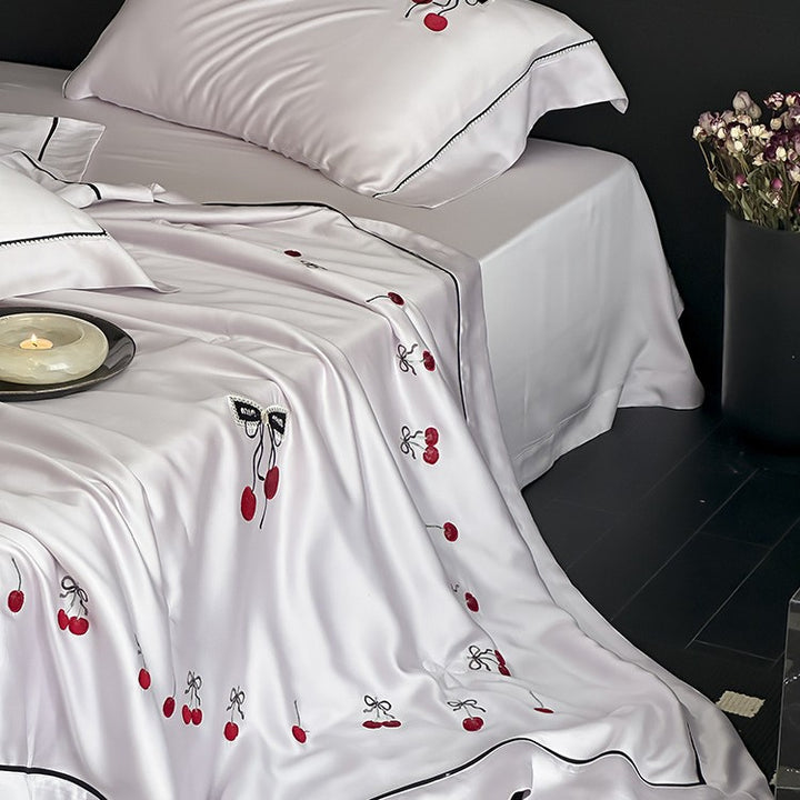 Cotton satin bedding set with cherry embroidery and contrasting piping
