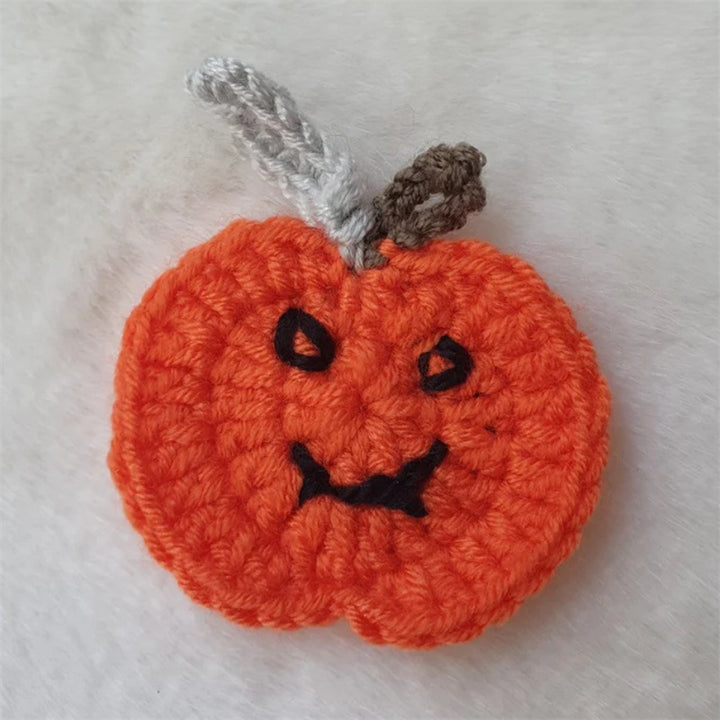 Hand-crocheted pumpkin pot holder and table mat made of cotton yarn