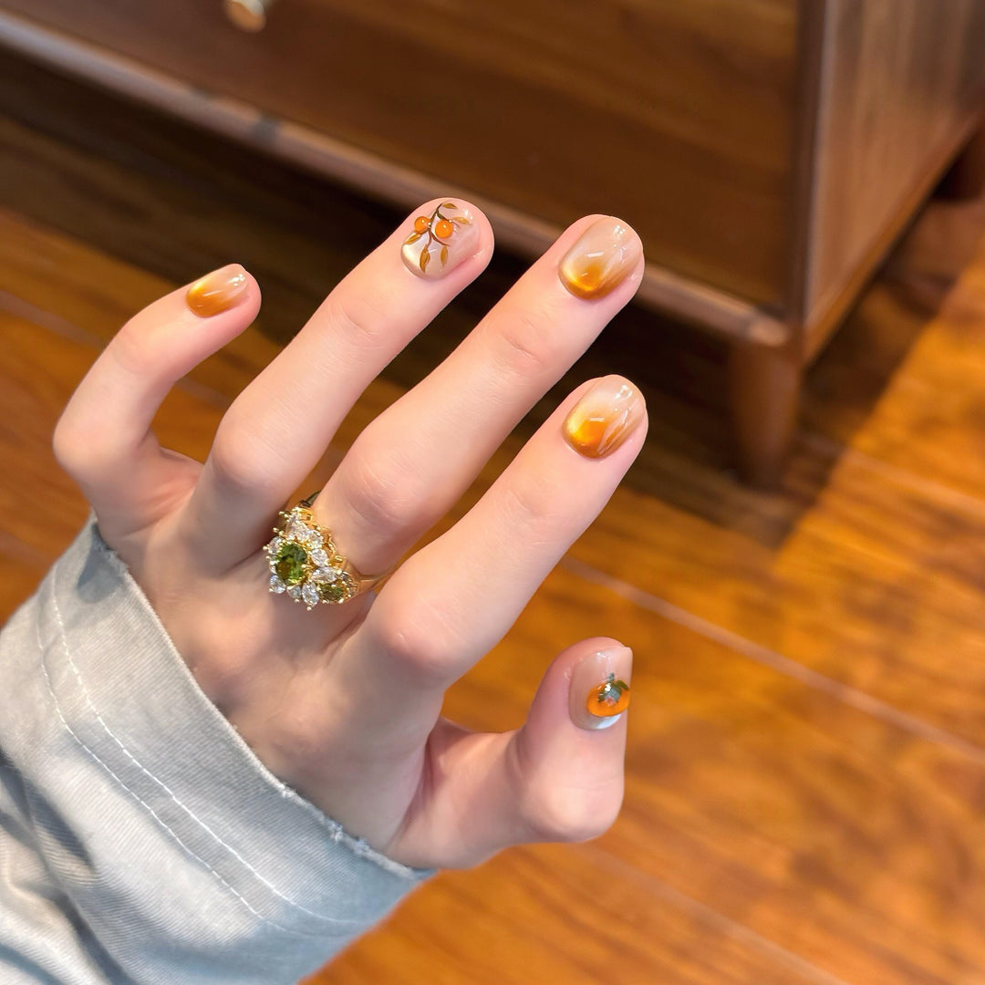 Artificial nails in elegant ombre look with floral accent Kalsten