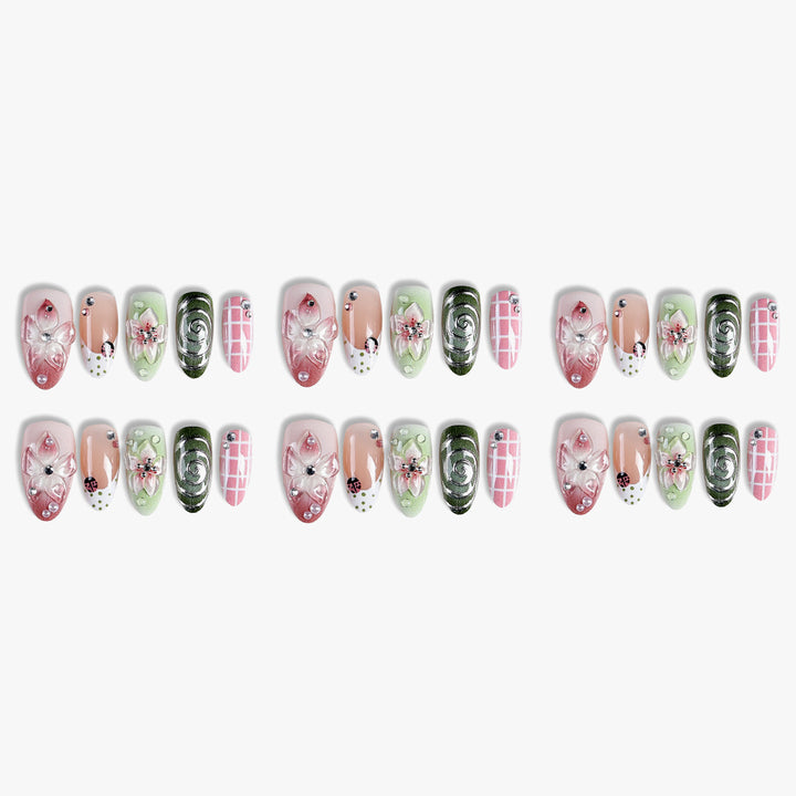 Artificial nail set with floral accents and glitter details Kalsten