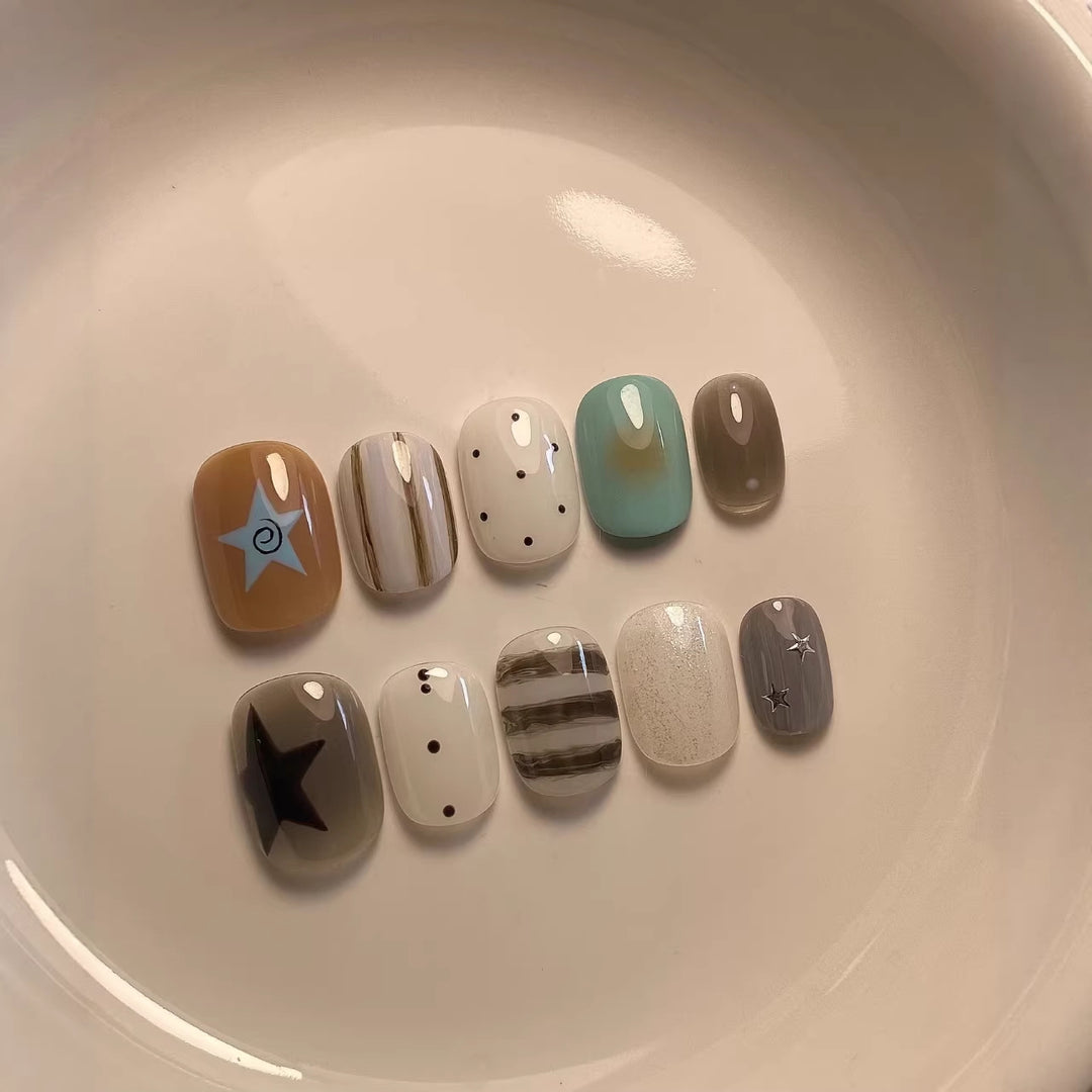 Artistic Press-On Nail Set with Geometric and Star Designs