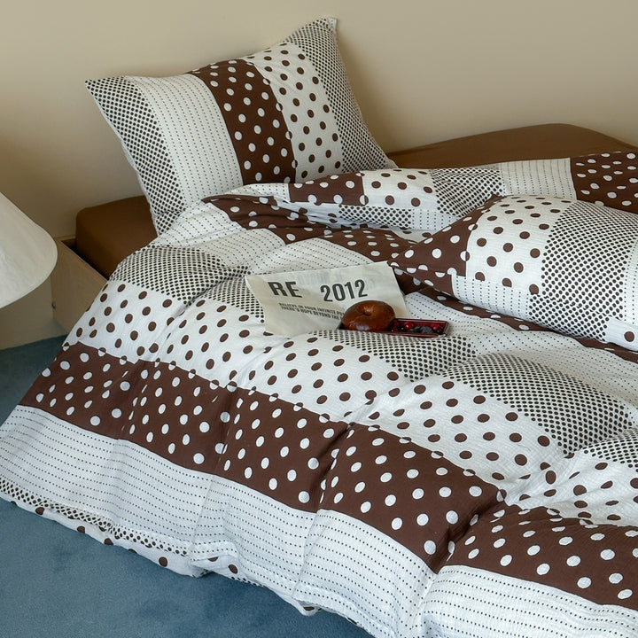 Reversible cotton percale bedding set with patched dot pattern and breathable quilted texture