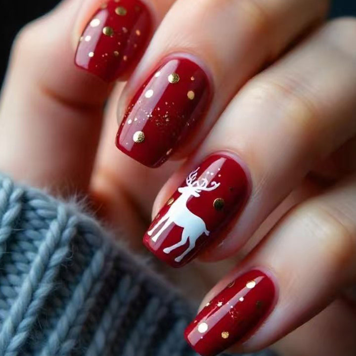 Creative artificial nails with festive reindeer design Kalsten