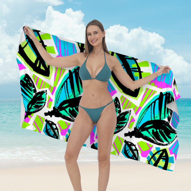 Beach towel with vibrant tropical plant motif Kalsten